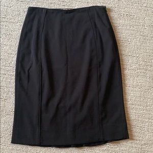 Fitted black pencil skirt with ruffle detail